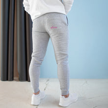 Load image into Gallery viewer, Staying active is no problem when you’ve got a stylish pair of premium-quality joggers like these. The back pocket is customizable and has two spacious pockets on the sides. The super comfy, medium-heavy fabric of the joggers also makes a great surface for any printed design.
