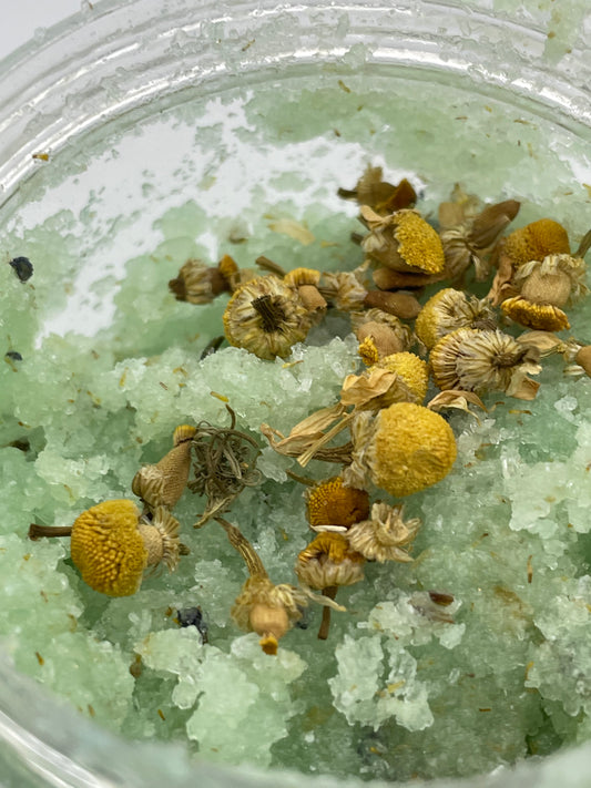 Your Glam Secret’s “Relax” luxurious bath salt and body scrub. Lavender and Lemongrass sugar salt scrub  drenched with coconut oil sweet almond and chamomile petals. Nourishing vitamin E to hydrate and protect while gently exfoliating.